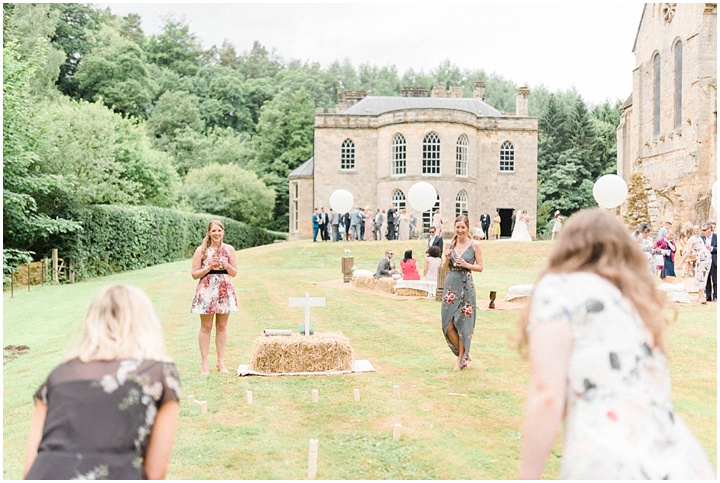 Brinkburn priory wedding photo of guests playing lawn games